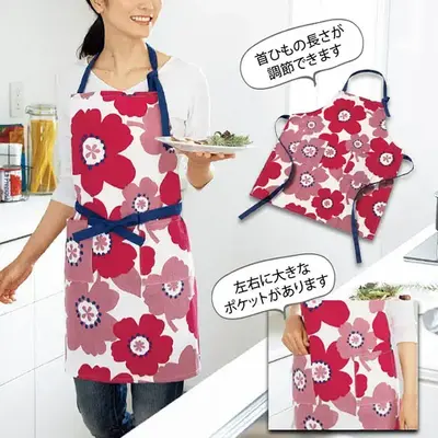 大胆な花柄が印象的なエプロンです。 大胆な花柄が印象的なエプロンです。